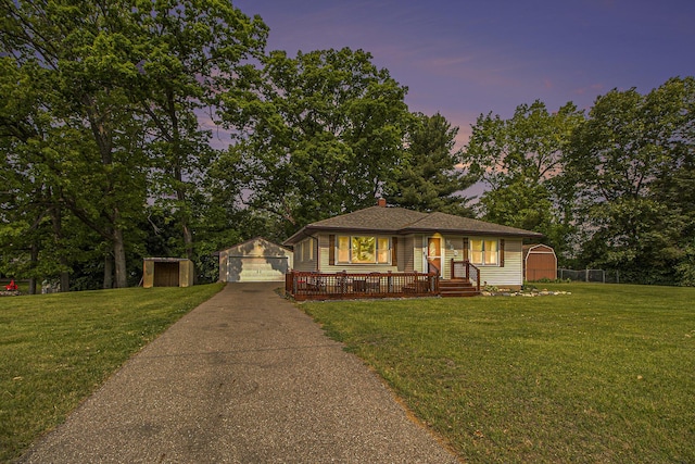 130 Woodway Ave, Battle Creek, MI 49014 - bungalow with a detached garage, covered porch, and a chimney
