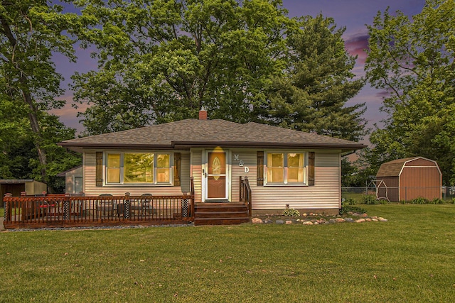 130 Woodway Ave, Battle Creek, MI 49014 - bungalow-style home featuring a lawn, a chimney, and a shingled roof