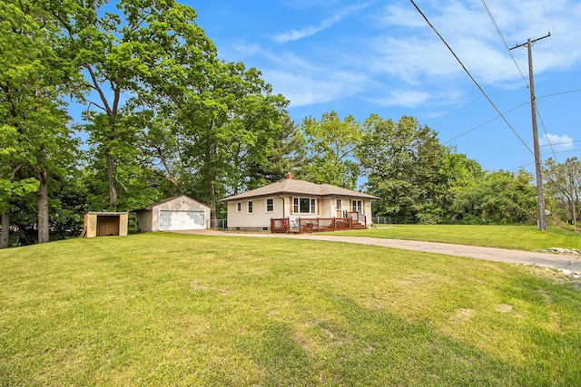 130 Woodway Ave, Battle Creek, MI 49014 - view of front facade with an outdoor structure, a detached garage, a front lawn, a chimney, and a deck