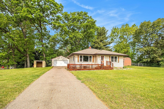 130 Woodway Ave, Battle Creek, MI 49014 - view of front of property with a detached garage, driveway, and a chimney