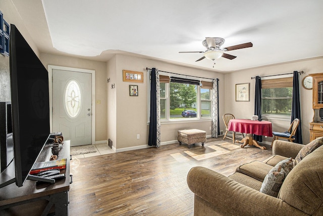 130 Woodway Ave, Battle Creek, MI 49014 - living room featuring a ceiling fan, wood finished floors, and baseboards