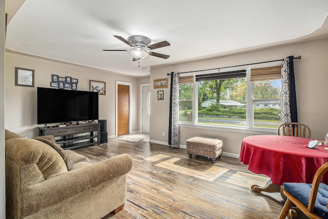 130 Woodway Ave, Battle Creek, MI 49014 - living room with ceiling fan, baseboards, and wood finished floors