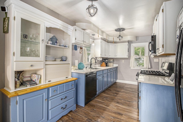 130 Woodway Ave, Battle Creek, MI 49014 - kitchen with blue cabinetry, black appliances, a sink, dark wood-style floors, and baseboards