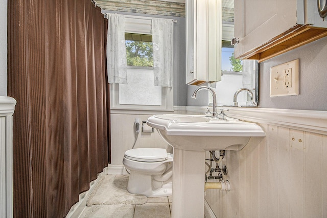 130 Woodway Ave, Battle Creek, MI 49014 - full bath with toilet, a shower with shower curtain, and tile patterned flooring