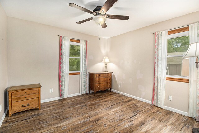 130 Woodway Ave, Battle Creek, MI 49014 - bedroom with wood finished floors, baseboards, and ceiling fan
