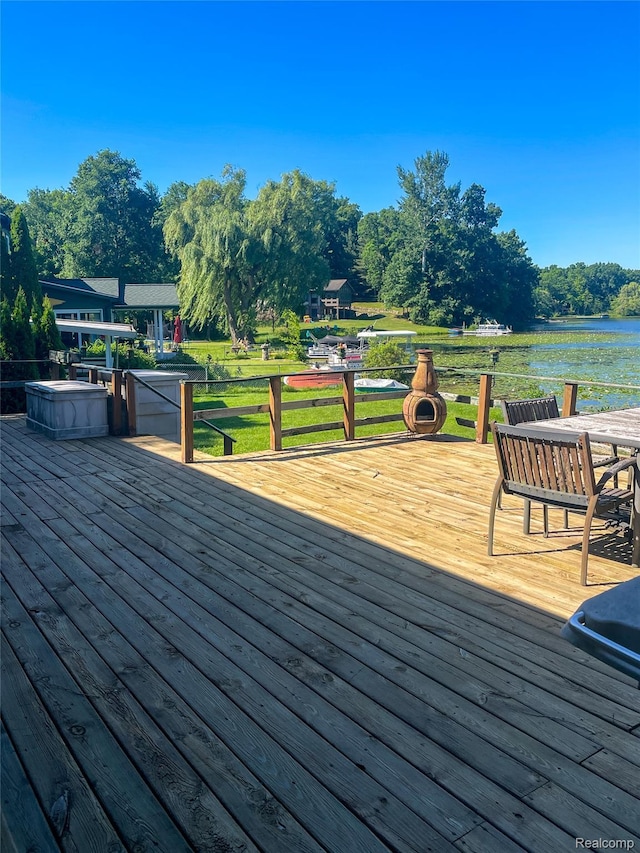 1749 Tannock Dr, Holly, MI 48442 - wooden deck with a water view and a lawn
