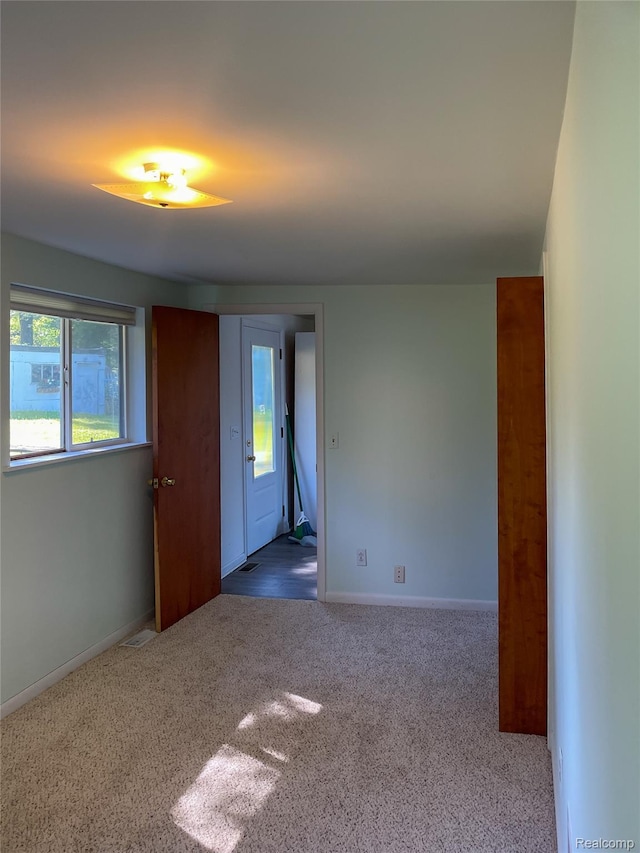 1749 Tannock Dr, Holly, MI 48442 - carpeted spare room with baseboards