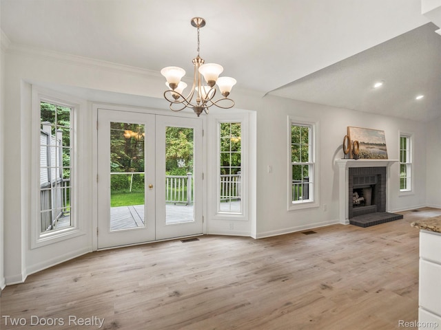 53020 Wolf Dr, Shelby Twp, MI 48316 - unfurnished living room with french doors, baseboards, light wood-style flooring, a chandelier, and crown molding