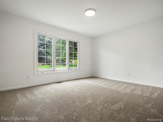 53020 Wolf Dr, Shelby Twp, MI 48316 - carpeted spare room featuring baseboards