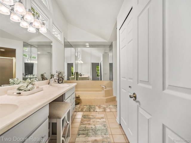 53020 Wolf Dr, Shelby Twp, MI 48316 - bathroom featuring lofted ceiling, double vanity, a bath, a stall shower, and tile patterned floors