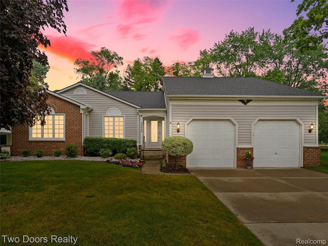 53020 Wolf Dr, Shelby Twp, MI 48316 - view of front facade featuring brick siding, a garage, driveway, and a front yard