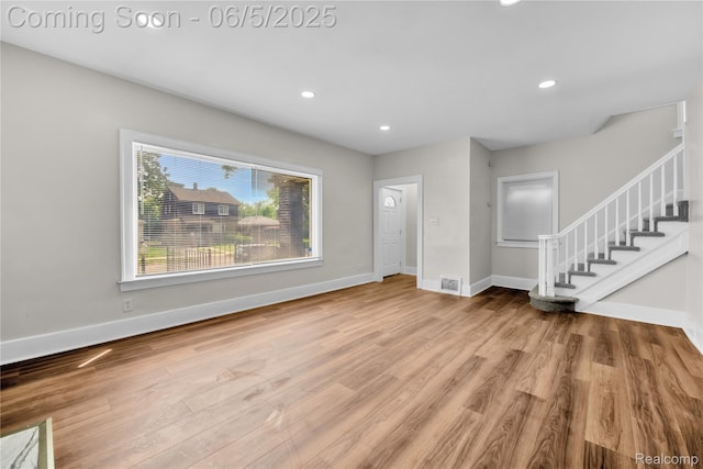 14953 Winthrop St, Detroit, MI 48227 - unfurnished living room featuring stairs, wood finished floors, baseboards, and recessed lighting