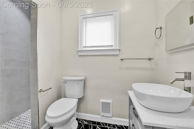 14953 Winthrop St, Detroit, MI 48227 - bathroom featuring baseboards, toilet, vanity, and tiled shower