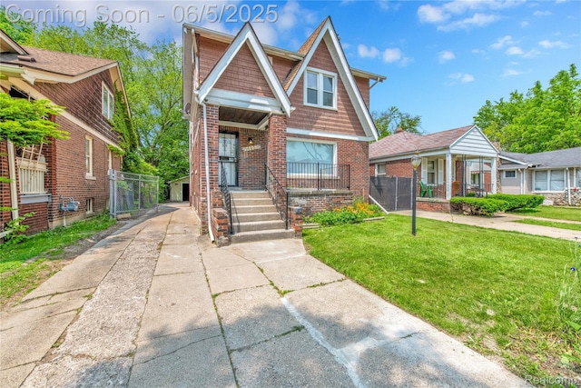 14953 Winthrop St, Detroit, MI 48227 - view of front facade featuring brick siding, driveway, and covered porch