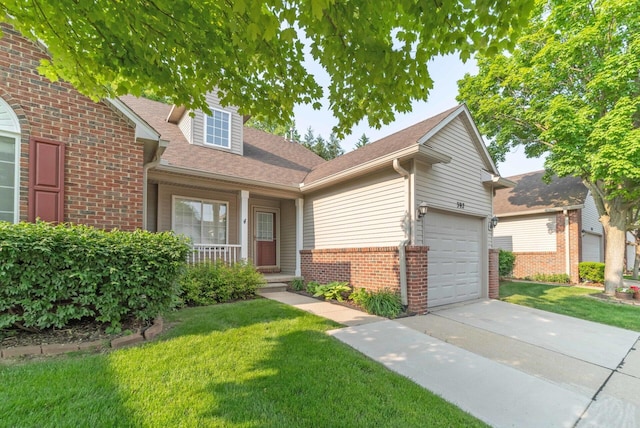 392 Woodfield Square Ln, Brighton, MI 48116 - view of front facade with brick siding, driveway, a porch, and a front yard