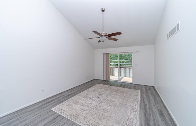 392 Woodfield Square Ln, Brighton, MI 48116 - empty room with vaulted ceiling, wood finished floors, ceiling fan, and baseboards
