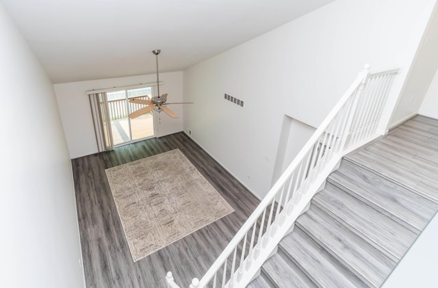 392 Woodfield Square Ln, Brighton, MI 48116 - stairway featuring wood finished floors, vaulted ceiling, and a ceiling fan
