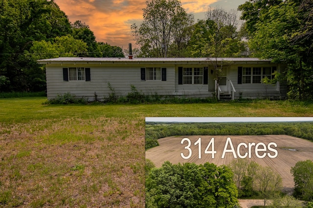 5125 S 148th Ave, Hesperia, MI 49421 - ranch-style house with a front yard, a metal roof, and entry steps