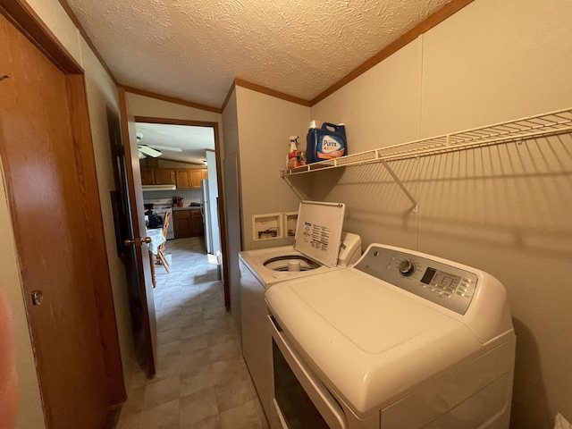 8295 Mccain Rd, Parma, MI 49269 - washroom with washing machine and clothes dryer, ornamental molding, and a ceiling fan