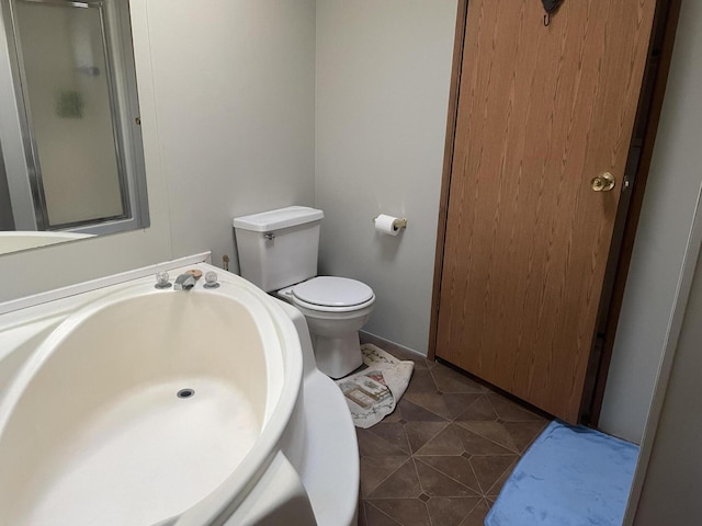 8295 Mccain Rd, Parma, MI 49269 - full bath featuring toilet, a shower with shower door, and tile patterned floors