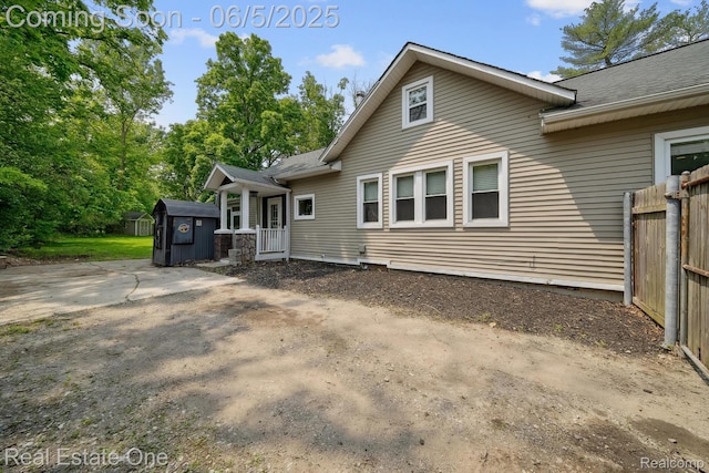 8921 Lake Rd, Grosse Ile, MI 48138 - rear view of property with a shingled roof