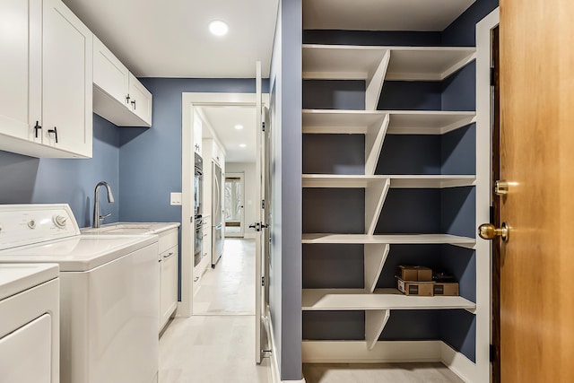 3000 Glazier Way Unit 130, Ann Arbor, MI 48105 - laundry area with cabinet space, separate washer and dryer, and recessed lighting