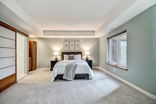 3000 Glazier Way Unit 130, Ann Arbor, MI 48105 - bedroom with carpet flooring, a tray ceiling, and baseboards