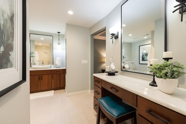 3000 Glazier Way Unit 130, Ann Arbor, MI 48105 - bathroom with vanity, tile patterned floors, baseboards, and recessed lighting