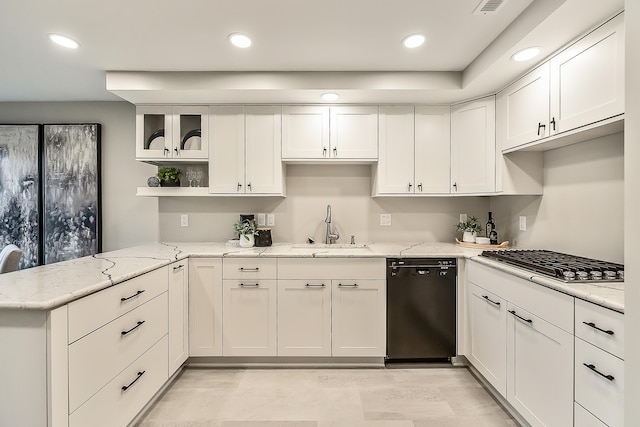 3000 Glazier Way Unit 130, Ann Arbor, MI 48105 - kitchen with black dishwasher, a sink, stainless steel gas cooktop, white cabinetry, and a peninsula