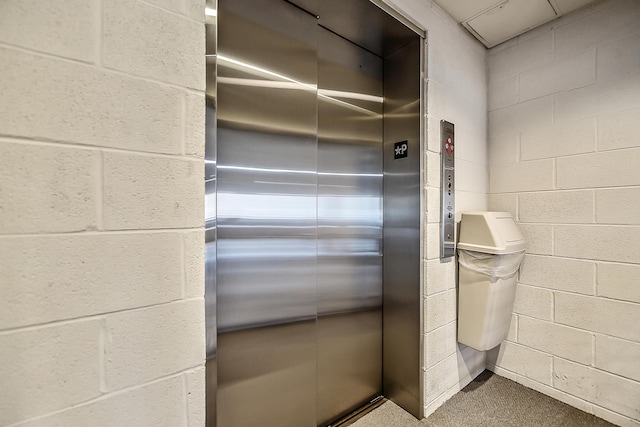 3000 Glazier Way Unit 130, Ann Arbor, MI 48105 - elevator featuring carpet flooring and concrete block wall