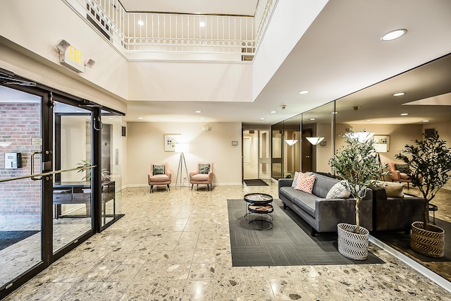 3000 Glazier Way Unit 130, Ann Arbor, MI 48105 - living room with baseboards, recessed lighting, and a towering ceiling