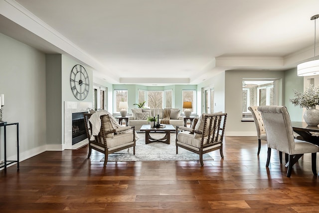 3000 Glazier Way Unit 130, Ann Arbor, MI 48105 - living area with plenty of natural light, a fireplace, dark wood finished floors, baseboards, and crown molding