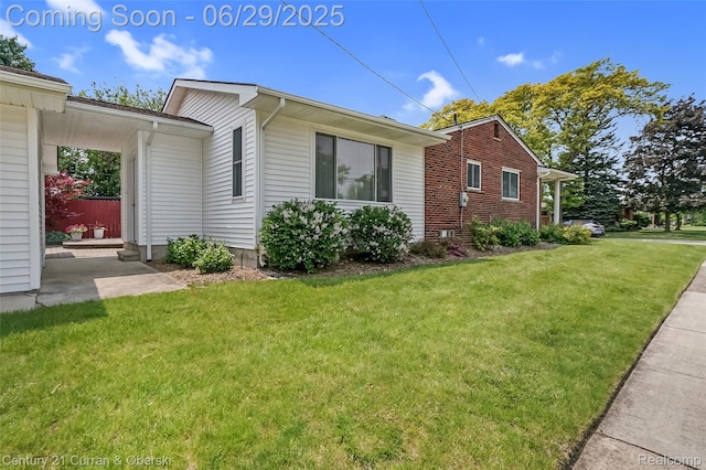 1356 N Selfridge Blvd, Clawson, MI 48017 - view of side of home featuring a lawn