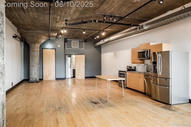460 W Canfield Street Loft 207/ Unit 16, Detroit, MI 48201 - kitchen featuring appliances with stainless steel finishes, a sink, light wood-type flooring, track lighting, and light brown cabinets