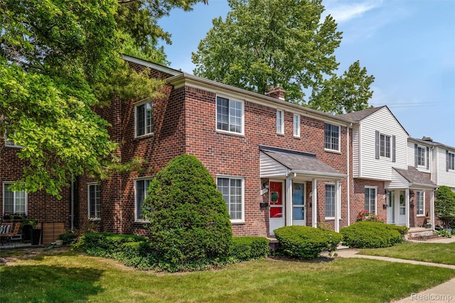 22953 Allen Rd, Saint Clair Shores, MI 48080 - view of front of house featuring brick siding, a chimney, and a front lawn