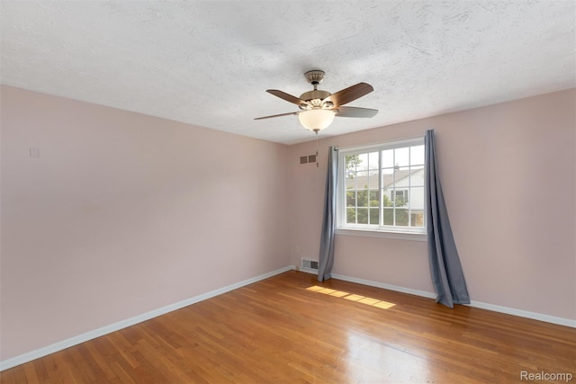 22953 Allen Rd, Saint Clair Shores, MI 48080 - unfurnished room with light wood finished floors, a textured ceiling, and a ceiling fan