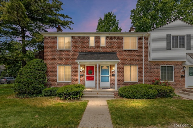 22953 Allen Rd, Saint Clair Shores, MI 48080 - view of front of home featuring a chimney, brick siding, and a lawn