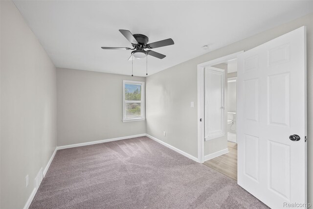 19215 Winthrop St, Dearborn, MI 48235 - unfurnished bedroom with light colored carpet, baseboards, and ceiling fan