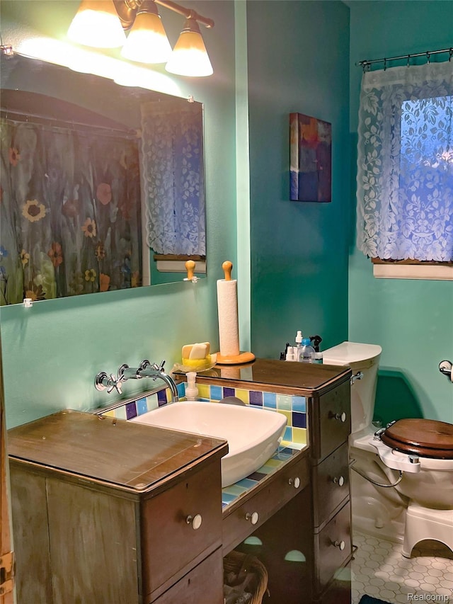 21710 Parklawn St, Oak Park, MI 48237 - full bath with vanity, toilet, and tile patterned floors