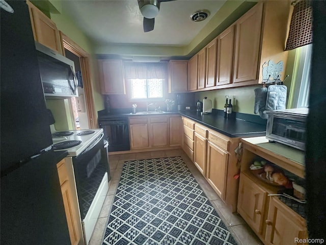 21710 Parklawn St, Oak Park, MI 48237 - kitchen featuring black appliances, a sink, light tile patterned floors, a ceiling fan, and dark countertops
