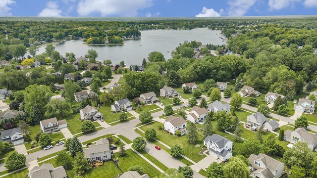 6533 Cannon Farms Dr NE, Rockford, MI 49341 - aerial perspective of suburban area featuring a large body of water and a forest