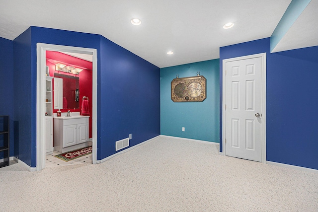 6533 Cannon Farms Dr NE, Rockford, MI 49341 - unfurnished bedroom with a sink, baseboards, recessed lighting, carpet flooring, and ensuite bath