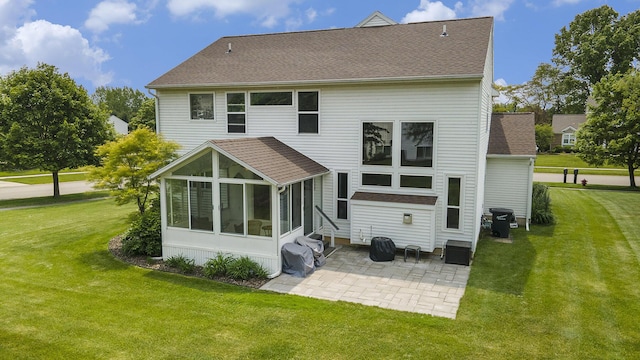 6533 Cannon Farms Dr NE, Rockford, MI 49341 - back of house featuring a patio area, a sunroom, a yard, and roof with shingles