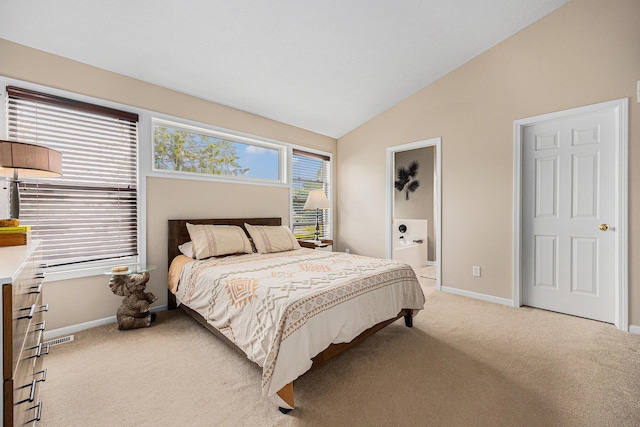 6533 Cannon Farms Dr NE, Rockford, MI 49341 - bedroom with light colored carpet, lofted ceiling, baseboards, and ensuite bath
