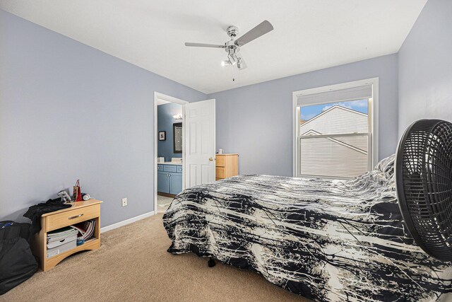 6533 Cannon Farms Dr NE, Rockford, MI 49341 - carpeted bedroom featuring baseboards, connected bathroom, and ceiling fan