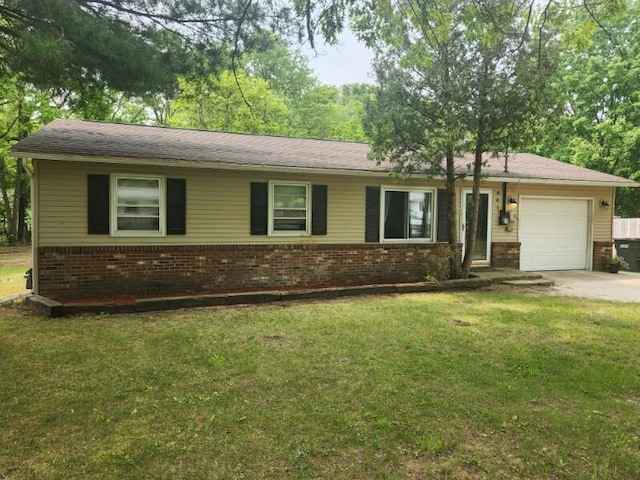 661 W Michigan Rd, Twin Lake, MI 49457 - ranch-style house with brick siding, an attached garage, concrete driveway, and a front yard