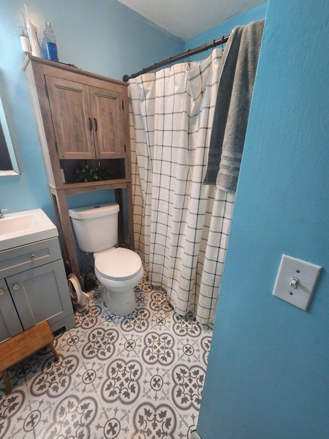 661 W Michigan Rd, Twin Lake, MI 49457 - bathroom with toilet, vanity, and a shower with shower curtain