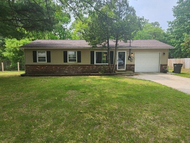 661 W Michigan Rd, Twin Lake, MI 49457 - single story home with brick siding, driveway, and a garage