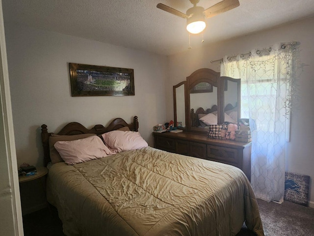 661 W Michigan Rd, Twin Lake, MI 49457 - carpeted bedroom featuring a textured ceiling and a ceiling fan