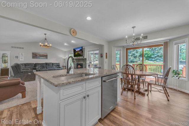 15719 Greenview, Fraser, MI 48026 - kitchen featuring stainless steel dishwasher, a chandelier, light wood-type flooring, decorative light fixtures, and lofted ceiling